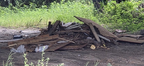 [Construction debris dumped under Hagan Bridge, 2026:06:26 11:47:57, 31.0137387, -83.3012887]