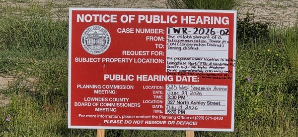 [Public Hearing sign on Hyta Mederer Drive, 2026:07:11 08:44:21, 30.8872157, -83.3165918]