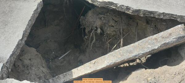 [Hole under driveway, 2026-06-04, 11:02:32 --Dennis Norman]