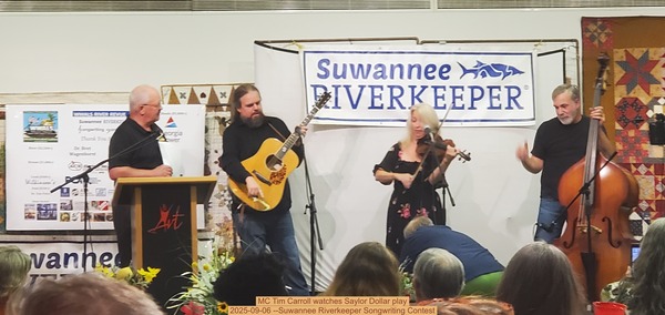 MC Tim Carroll watches Saylor Dollar play, 2025-09-06 --Suwannee Riverkeeper Songwriting Contest