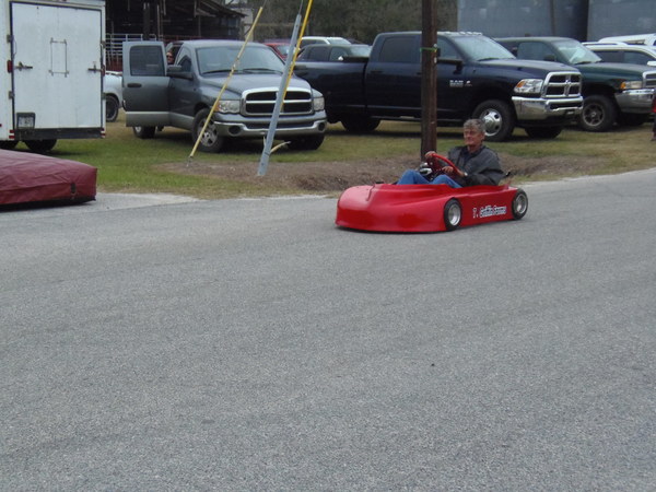 [Tiny red car]
