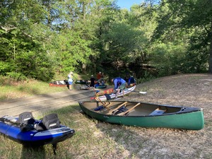 [Carl Fuller with the white kayak]