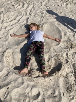 [Child in sand]
