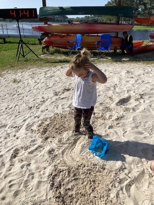 [Child still in sand]