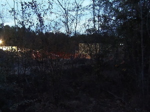 NW from Martin Lane: drill site, berm, fence, structure