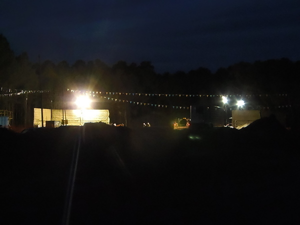 Safety fence in front of drill site with people