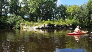 Rocks and field on left bank, 30.5877500, -83.2570000